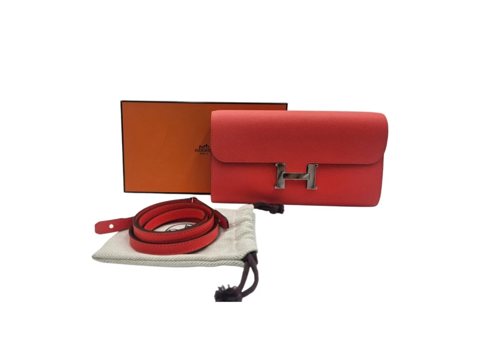     محفظة هيرميس كونستانس الطويلة من جلد إبسوم البرتقالي، مزودة بإكسسوارات من البالاديوم، رقم الموديل 