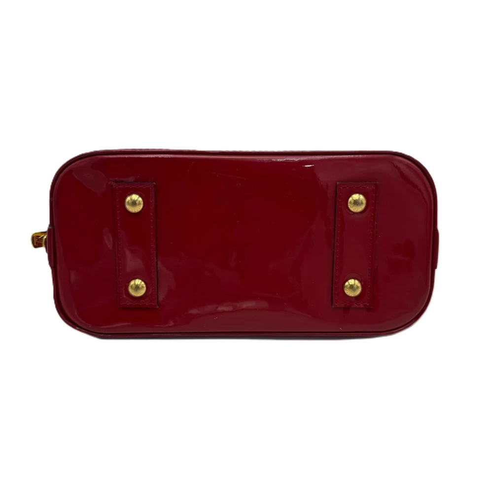     حقيبة لويس فويتون مونوغرام أحمر فيرنيس ألما BB 